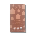 Chocolate bar with house silhouettes on the packaging, USDA Organic logo, and text noting “burnt” flavor and free from soy, gluten, and palm oil.
