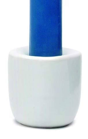 A blue candle stands upright in a Stoneware White Chime Candle Holder against a white background.