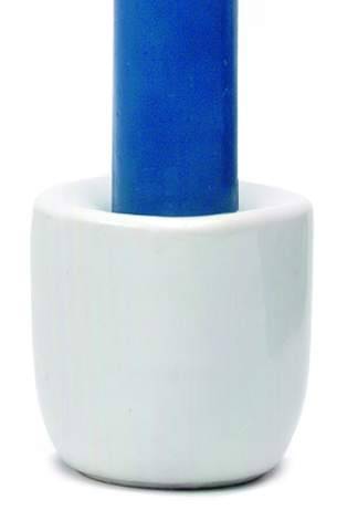 A blue cylindrical candle stands upright in the Stoneware White Taper Candle Holder, set against a white background.