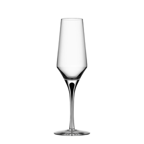 A clear, empty Orrefors Metropol Champagne Glass 9oz with a long stem and slightly tapered bowl, set against a plain white background.