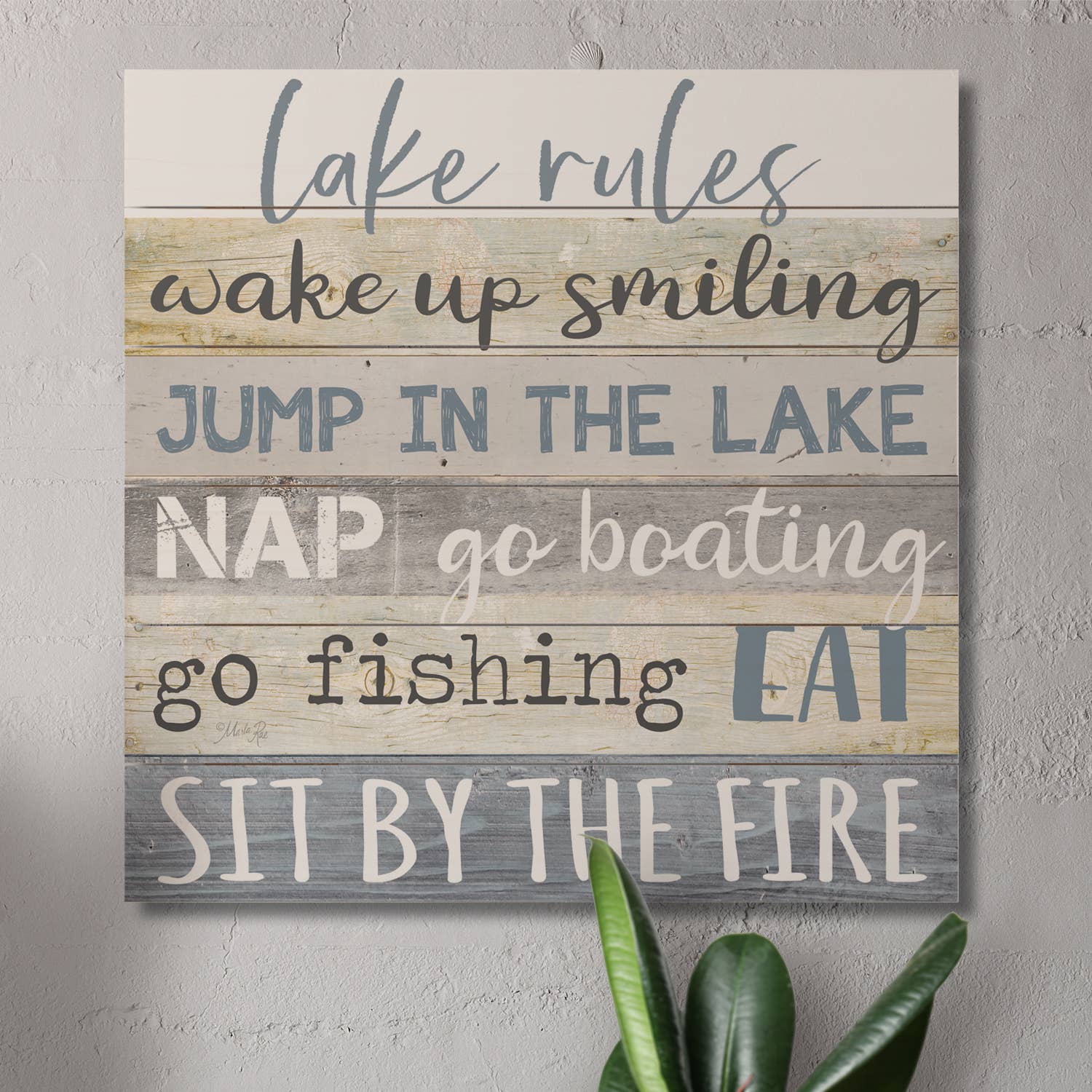 The "Lake Rules" Decorative Slatted Pallet Wood Sign, made from solid pine wood slats, features delightful lake-themed rules: wake up smiling, jump in the lake, nap, go boating, fish, eat, and relax by the fire. It's an ideal addition for rustic home designs.