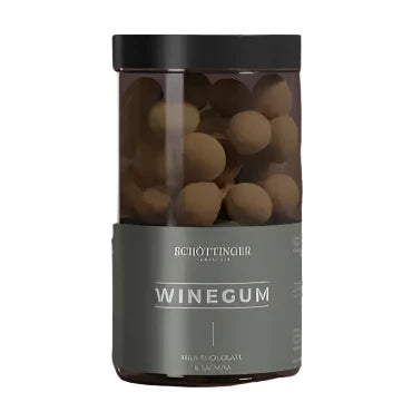 A jar of exquisite Winegum Milk chocolate & Salmiak candies, featuring a sophisticated gray label with the product name prominently in bold text.