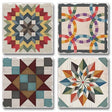 This set includes four 4" square Barn Quilt Signs stone coasters with cork backing, each featuring a unique colorful geometric quilt pattern on a distressed white background to enhance your Scandinavian decor.