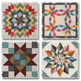 This set includes four 4" square Barn Quilt Signs stone coasters with cork backing, each featuring a unique colorful geometric quilt pattern on a distressed white background to enhance your Scandinavian decor.