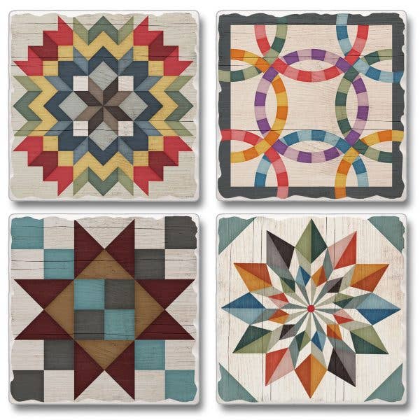 Four stone coasters featuring barn quilt signs with colorful geometric designs, including star and interlocking ring motifs, with cork backing. .