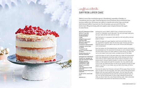 Saffron layer cake with white frosting and red berries on a cake stand, visible layers, Scandinavian style; recipe page placed next to the cake.