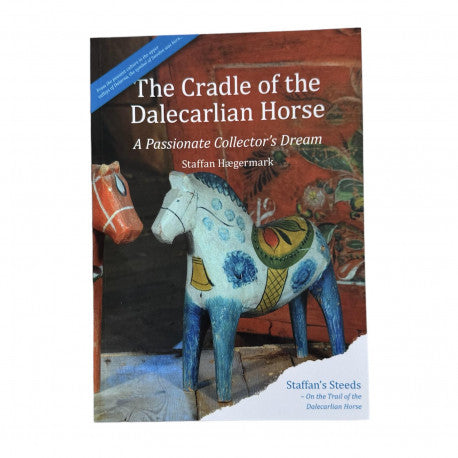 Book cover of *Cradle of the Dalecarlian Horse* by Staffan Hegermark, a collector's dream with vibrant Dalahorse figurines.