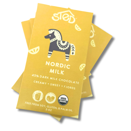 Three yellow Nordic Milk chocolate wrappers with a stylized horse and USDA Organic logo arranged on a white background.