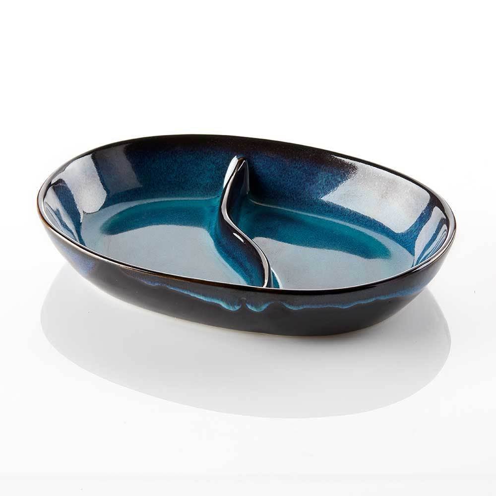 The Lake Life Ceramic Divided Oval Dish features a handmade blue gradient glaze, a central divider for two compartments, and is dishwasher safe for easy cleaning.