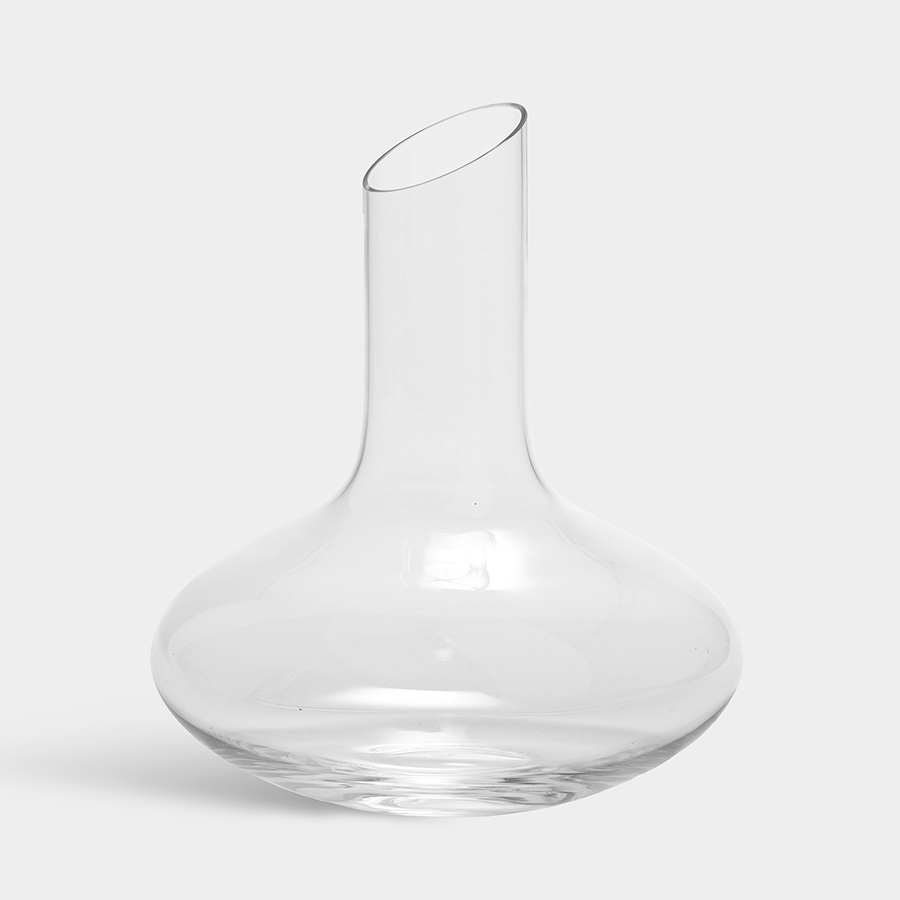 The Orrefors: Enjoy Decanter 34oz, reminiscent of Erika Lagerbielkes iconic designs, features a wide base and a narrow, slightly off-center neck set against a plain white background.