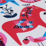 A stylized red horse with floral patterns and a pink bird holding a strawberry decorates this Swedish Dala Horse Birch-Wood Tray (8x10.5 in), inspired by the classic design and crafted on white birch wood.