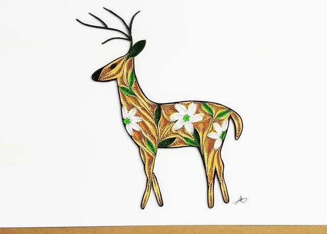 The Card: Floral Deer Quilling Card showcases intricate handcrafted quilling with colorful swirls and floral designs embellishing a majestic deer on premium paper against a simple backdrop.