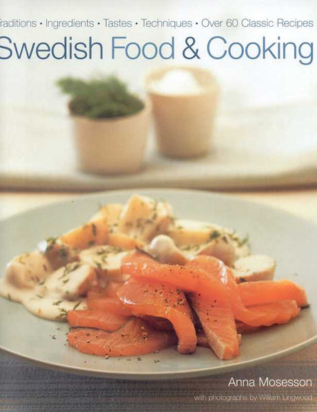 A plate of cured salmon with dill and sauce sits in front, evoking Swedish tradition. Discover more in "Book - Swedish Food and Cooking by Anna Mosesson Ingredients * Tastes * Techniques * 60 Classic Recipes.