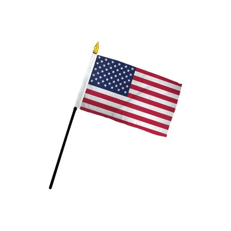 The Flag: USA/United States Stick Flag – 4x6 Inch Handheld Flag features 50 stars and 13 stripes on fabric, attached to a black stick with a gold spear tip. Perfect for patriotic displays or events.