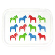 The Tray: "Dalahast" Dala Horse Decorative Tray (3"x11", birch veneer) is made in Sweden and features twelve white stylized horses with hearts, polka dots, and stars in green, blue, and red.
