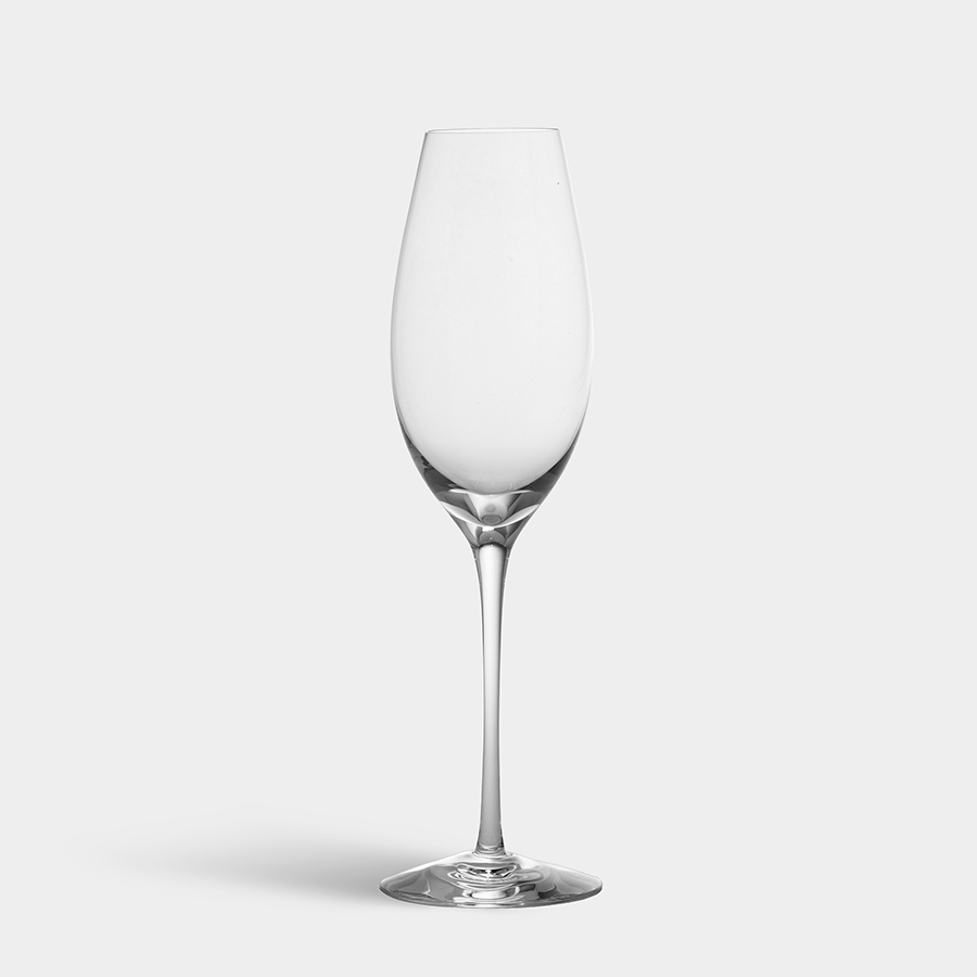 The Orrefors Difference Sparkling Wine Glass 10oz, a clear, mouth-blown masterpiece, exudes Swedish craftsmanship as it sits elegantly on a plain white background.