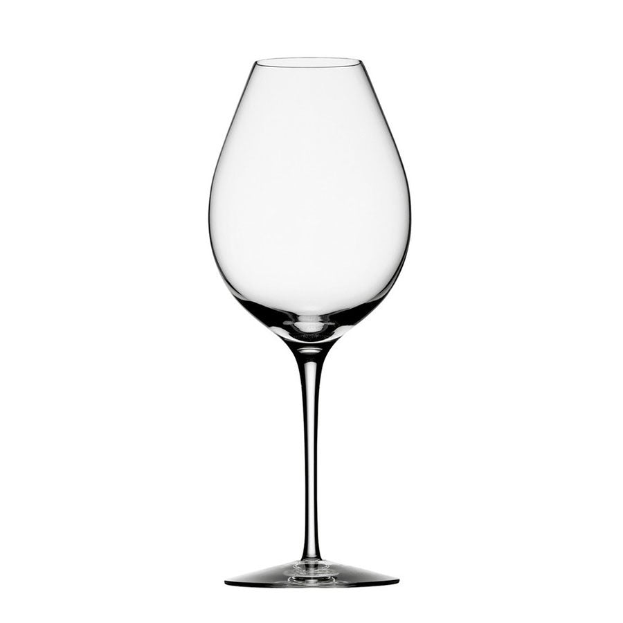 The Orrefors Difference Primeur Glass 21oz (2-Pack), crafted by Erika Lagerbielke, showcases a tall stem, clear bowl, and round base, elegantly depicted against a plain white background.