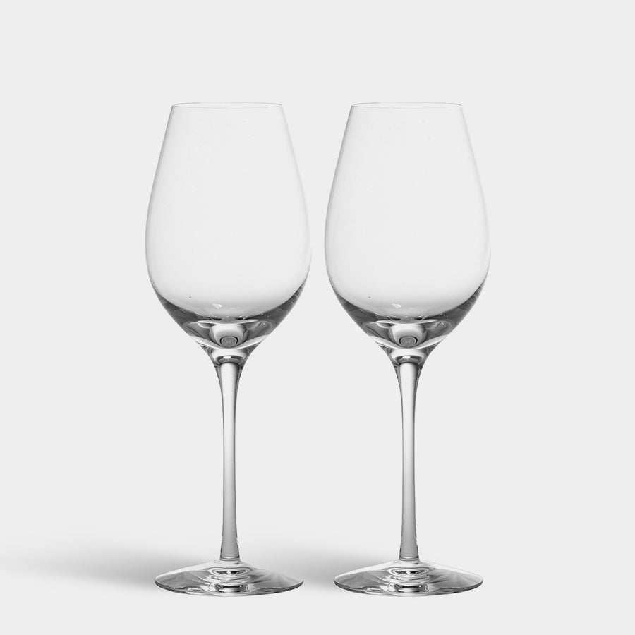 Two mouth-blown Orrefors: Difference Crisp Wine Glasses, 15oz each, designed by Erika Lagerbielke, with long stems stand against a plain white backdrop.