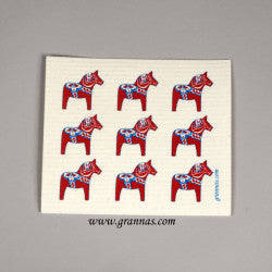 Nine red horse illustrations adorn a square white cloth, designed as the "Dish Cloth: Dala Horses 9 Red Horses." These Swedish dish cloths are not only environmentally friendly but also super absorbent and charming.