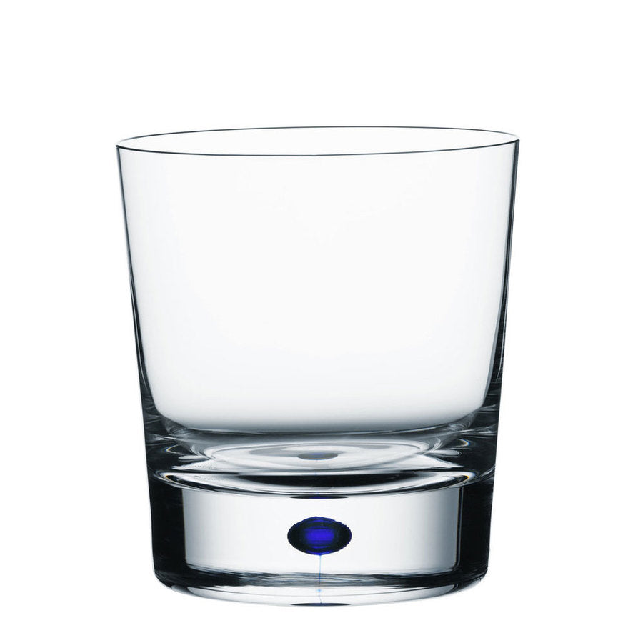 The Orrefors Intermezzo Blue Double Old Fashioned Whiskey 11oz glass is designed with a classic look, featuring a thick base and an elegant small Intermezzo Blue accent embedded at the bottom.