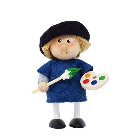 The Figurine: Scandinavian Boy Artist in Blue showcases a toy artist wearing a blue smock and black beret, holding a paintbrush tipped with green and a colorful palette. Its an ideal tabletop decoration that adds charming whimsy to any Scandinavian decor.