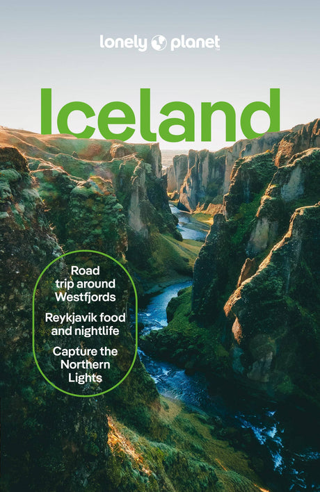 The cover of the Book: Lonely Planet Iceland Travel Guide features a lush green canyon and highlights road trips, Reykjavik nightlife, and Northern Lights—your perfect companion for planning an unforgettable Iceland adventure.