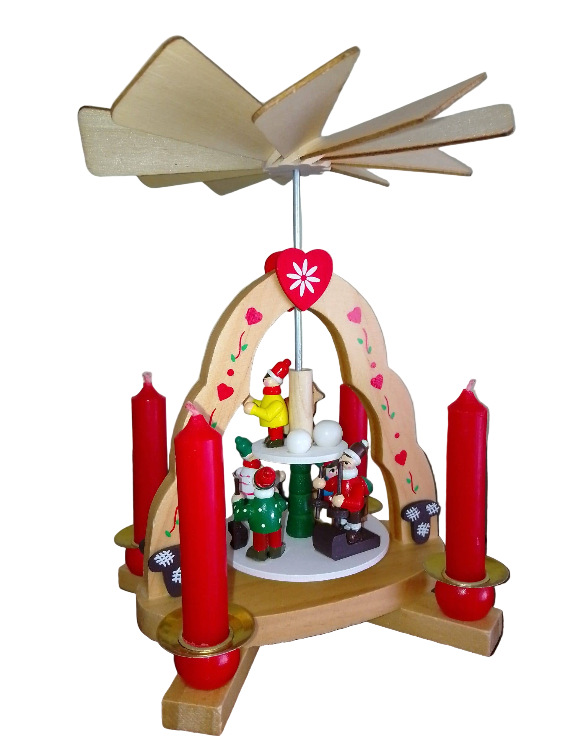 The Pyramid: Christmas Pyramid with "Kids" Candle Holder is 7" tall and 6" wide, holds 4 candles, and features handcrafted figures beneath a spinning fan—made in Germany for a festive touch.