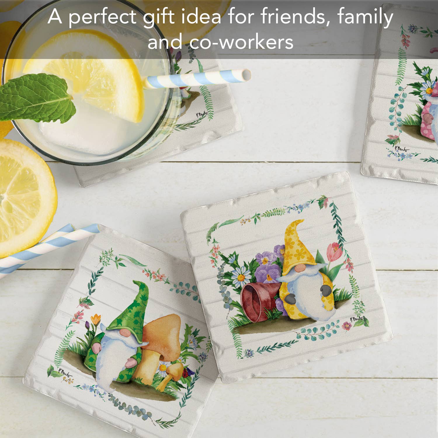 The Coaster: Spring Gnomes Tumbled Tile Coaster with cork back, featuring 4 images in a 4 pack, is displayed on a table alongside a glass of lemon water. Text reads: A perfect gift idea for friends, family, and co-workers.