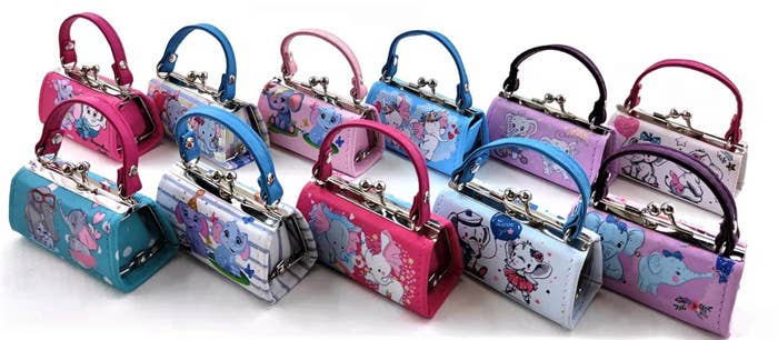 A set of Cartoon Elephant Mini Purses in vibrant hues of pink, blue, and purple, showcasing a variety of styles, organized in three rows.