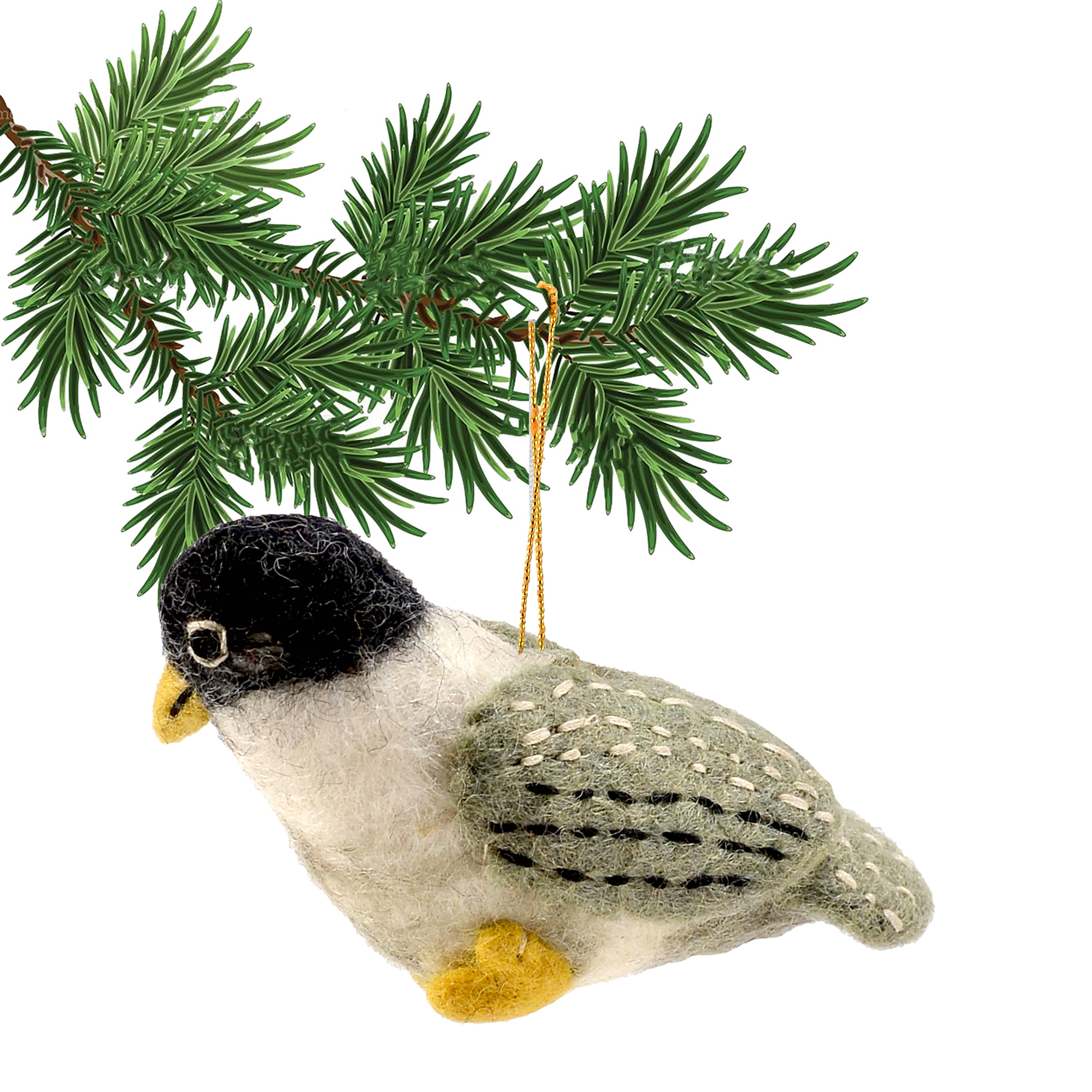 The delightful grey and white felt bird ornament features vibrant yellow feet and lush green wings, meticulously crafted from 100% wool. It gracefully dangles from a verdant pine branch, infusing a whimsical charm into your seasonal décor.