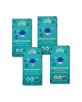 Four teal-wrapped milk chocolate bars with wild blueberries and a blue buffalo graphic, arranged in a grid on a white background.