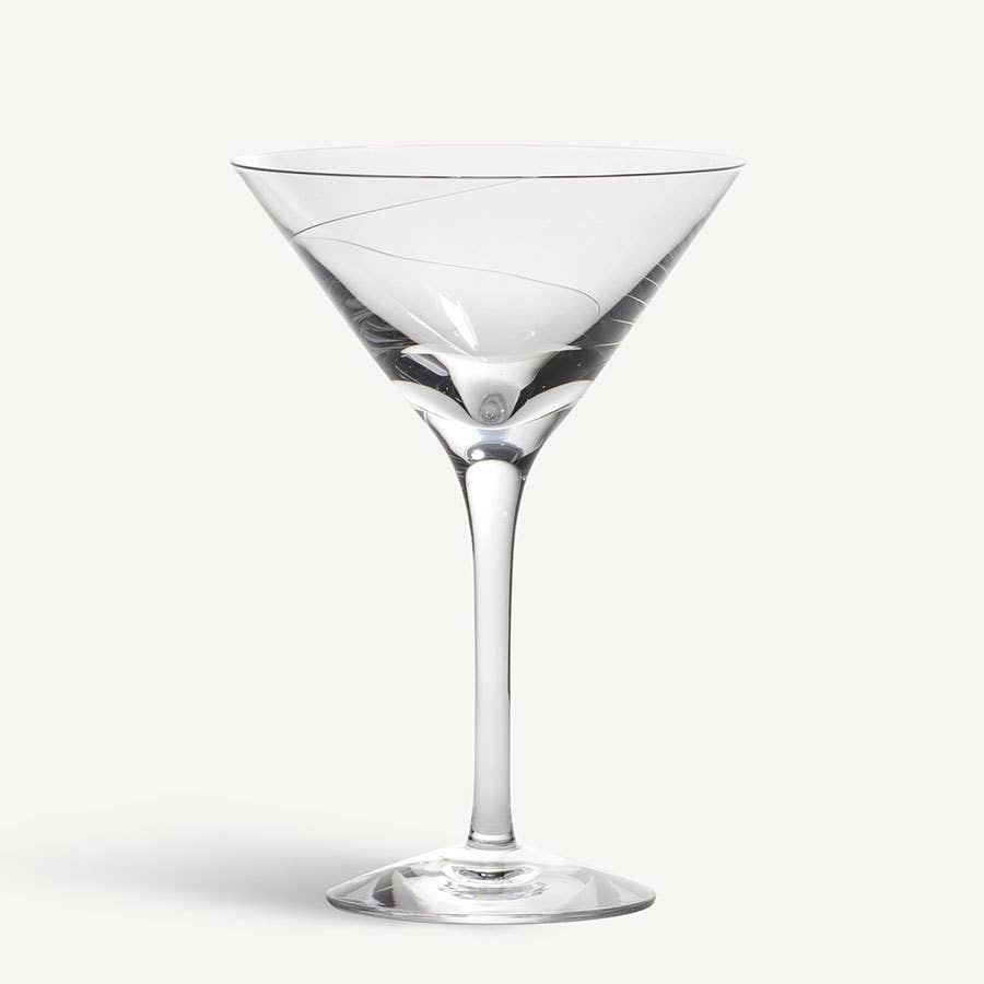 The KostaBoda Line Martini Glass, featuring a long stem and clear Swedish craftsmanship, is displayed against a plain white background.