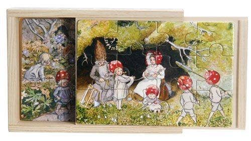 A wooden box holds four Elsa Beskow "Children of the Forest" tray puzzles, with charming nature-themed scenes ready to explore.