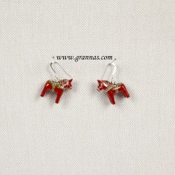 Two small, handcrafted Dala horse-shaped earrings in vibrant red, each measuring 2cm (0.75) high, rest against a pristine white background with www.grannas.com elegantly inscribed above.