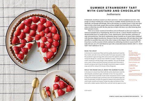 A strawberry tart inspired by Scandinavian baking from the book "Scandinavian from Scratch" by Penguin Random House sits on a white plate, topped with fresh strawberries. A slice is served nearby with a gold fork on checked cloth. Recipe text appears on the right.