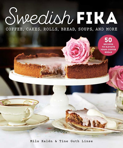 Cover of the book Swedish Fika: Cakes, Rolls, Bread, Soups, and More by Milo Kalen, features a cake on a stand with a slice on a plate and pink roses. Subtext reads 50 recipes to elevate your coffee break.