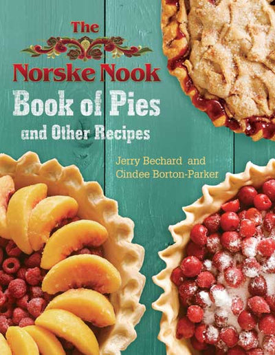 The cover of "Book: Norske Nook Book of Pies and Other Recipes," showcasing three fruit-topped pies, highlights the book's heritage with its collection of award-winning pie recipes from the National Pie Championships. The authors are Jerry Bechard and Cindee Borton-Parker.