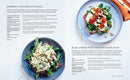 Two pages from the ScandiKitchen Cookbook book showcase salad recipes, each accompanied by a color photograph. On the left, you’ll find a zucchini salad atop greens, while the right page presents a black vinegar duck salad with pak choy and noodles, offering a delightful touch of Scandinavian inspiration in every dish.