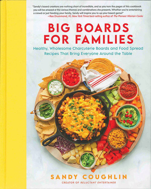 Cover of the book "Big Boards for Families" by Sandy Coughlin, beautifully displaying a delightful assortment of food boards featuring nachos, dips, and vegetables. Ideal for family meals and brimming with expert hosting tips to make every gathering unforgettable.