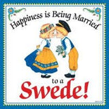 The Tile: Happiness is Being Married to a Swede Kitchen Wall Ceramic Plaque 6x6 features a Swedish couple in traditional dress kissing, with the heartwarming phrase—ideal as kitchen décor or a unique wall accent.