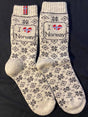 Wool socks with a Nordic pattern and “I ❤️ Norway” text, where the heart displays the Norwegian flag.