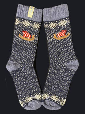 Socks: Viking Ship on Black and Natural Wool by Swedish Passport Co—wool socks with Nordic diamond patterns and a red-white Viking ship, shown side by side on a dark background.