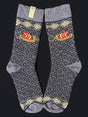 Socks: Viking Ship on Black and Natural Wool by Swedish Passport Co—wool socks with Nordic diamond patterns and a red-white Viking ship, shown side by side on a dark background.
