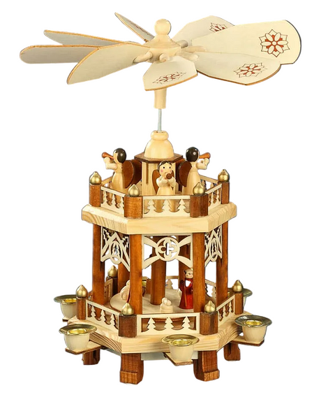 The Pyramid: Nativity Fence Christmas Pyramid is a handcrafted German decoration with candle holders, charming figurines, a spinning fan on top, and a delightful Nativity Scene.
