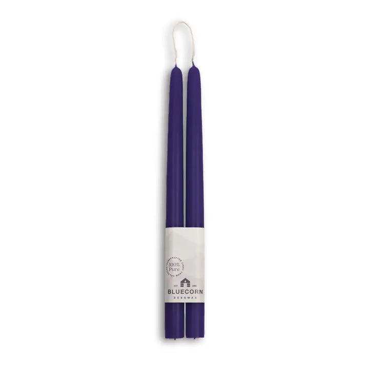 Two handmade, eco-friendly beeswax taper candles (2-pack, 12" each) are bundled with a Bluecorn Beeswax label—dripless and perfect for adding a sustainable touch.