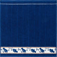 Square cotton towel in dark blue with a horizontal white border patterned with blue birds on branches.