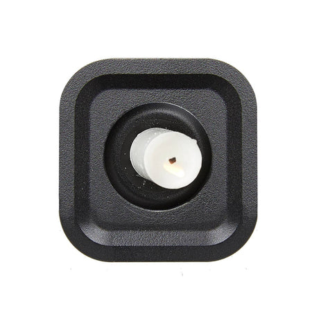 A close-up of the Candle Holder: Stumpastaken Ettan, crafted from 100% recycled material with a white powder-coated finish and minimalist design (8.8x8.8x4 cm), viewed from above on a white background.