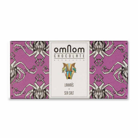 OmNom Lakkris + Sea Salt is a 60g Icelandic white chocolate bar with licorice and sea salt, from Reykjavik. Bold flavors come wrapped in a striking package with an abstract geometric animal design and illustrated pattern.