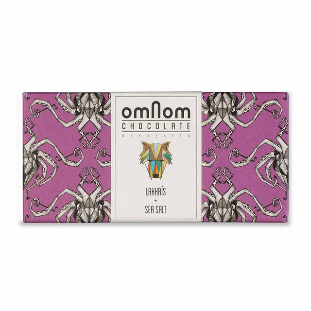 OmNom Lakkris + Sea Salt is a 60g Icelandic white chocolate bar with licorice and sea salt, from Reykjavik. Bold flavors come wrapped in a striking package with an abstract geometric animal design and illustrated pattern.