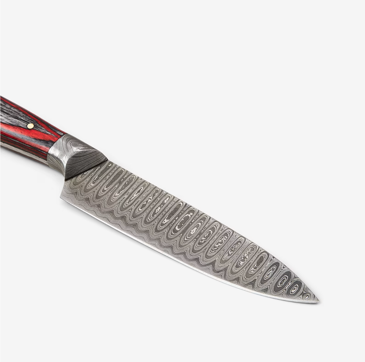 Chef’s knife with a Damascus steel patterned blade and wooden handle, positioned on a white background.